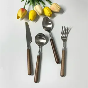 304 stainless steel cutlery set with walnut handles featuring a knife fork and two spoons