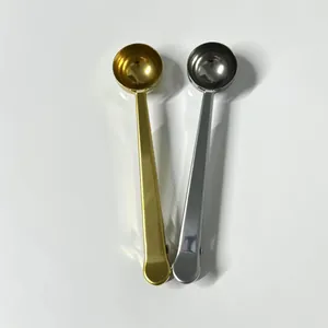 Set of gold and silver stainless steel coffee measuring spoons with sealing bag clip