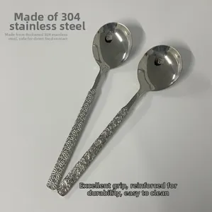 Detail of 304 stainless steel spoons with daisy pattern and hammered texture handles