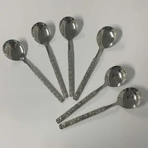 Detail showing set of six 304 stainless steel spoons with engraved daisy texture handles