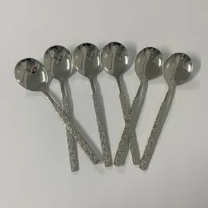 Set of six stainless steel spoons with daisy embossed handles and mirror finish