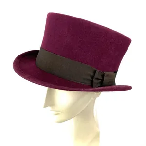 Detail of purple wool top hat with brown ribbed ribbon and elegant side bow