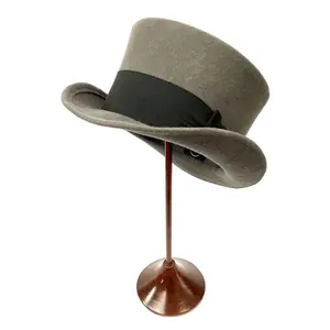 Elegant grey wool felt top hat with black grosgrain ribbon bow on a wooden stand