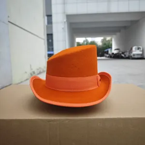 Detail shot of bright orange wool felt top hat with matching ribbon on a neutral background