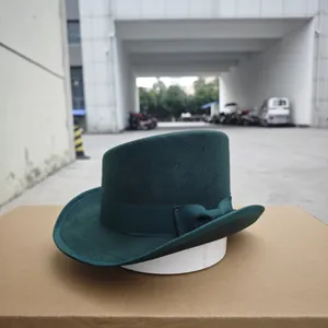Detailed view of dark green wool felt hat with decorative matching grosgrain ribbon band