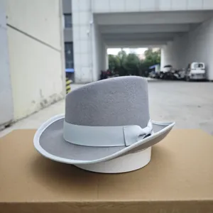 Detail of grey wool fedora hat with light blue ribbon band and elegant bow decoration