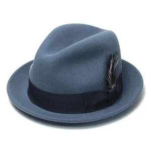 Detail of wool fedora hat featuring grosgrain ribbon and decorative side feather
