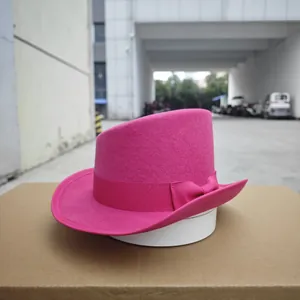 Close-up of rose red wool felt fedora hat with matching ribbon and elegant bow detail