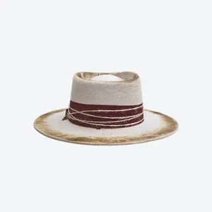 Detail of vintage teardrop wool felt hat featuring unique burnt edges and hemp rope trim