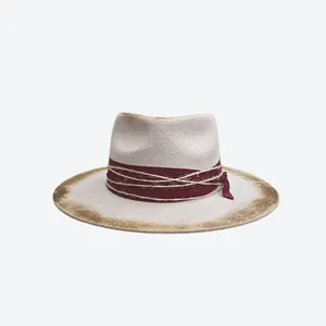 Vintage felt fedora hat with burnt edge brim and decorative cord ribbon on white background