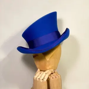 Deep royal blue wool felt top hat with asymmetrical design and matching satin ribbon band