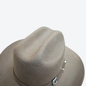 Detail of taupe wool felt cowboy hat featuring intricate silver engraved buckle