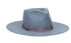 Detail of grey-blue wool fedora showing smooth felt texture and ribbon with metal badge