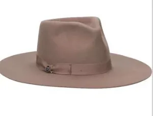 Detail view of pink wool felt fedora hat featuring a matching satin ribbon and metal logo accent