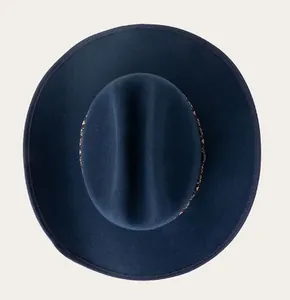 Top-down shot of navy blue wool fedora with a wide brim and ethnic patterned band