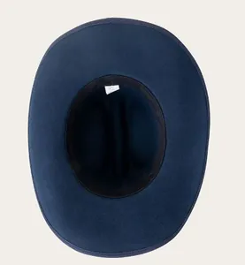Detailed interior view of a navy wool cowboy hat showing the sweatband and care label