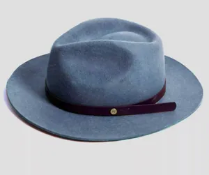 Detailed close-up of grey-blue wool fedora with purple faux leather belt and gold buckle