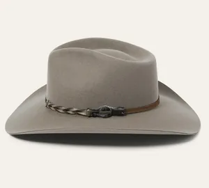 Close-up of light grey wool felt fedora featuring a woven brown leather band and metal logo