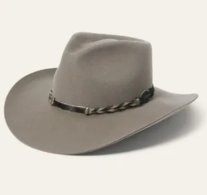 Macro detail of dark grey wool felt teardrop hat with braided leather strap buckle