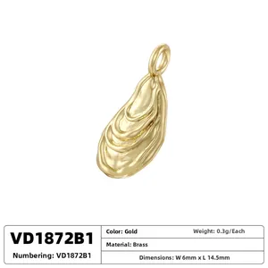 Detailed macro view of gold-plated brass oyster shell pendant with textured finish