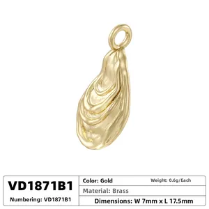 Macro detail of a 7mm x 17.5mm gold brass pendant with lava textured finish