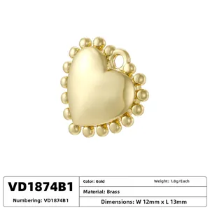 Detailed view of heart-shaped brass pendant in gold finish with 12x13mm dimensions