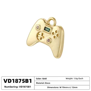 Detailed macro view of a golden brass game controller pendant showing 10mm by 12mm dimensions