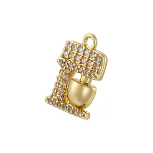 Detailed view of creative gold stand mixer pendant with sparkling cubic zirconia stones