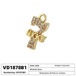 Macro shot of gold-plated lucky number 7 pendant with white zircon stones on brass