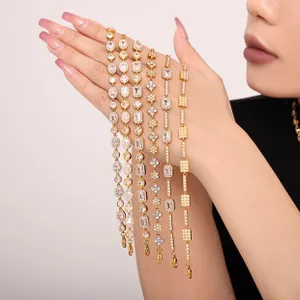 Detail of six gold tennis bracelets with various zircon cuts on a model hand