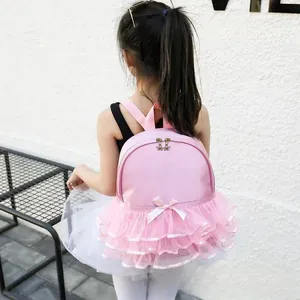 Detail of pink girls dance backpack with lace tutu skirt design and bow decoration