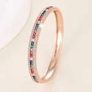Elegant rose gold bangle featuring rainbow zircon stones and double-row white crystal accents