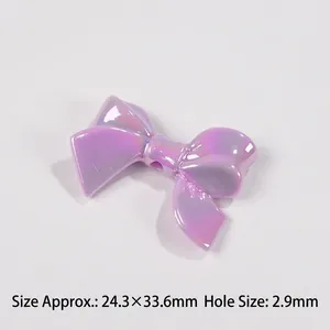 Macro detail of purple iridescent ribbon bow bead with 24.3x33.6mm size and 2.9mm hole
