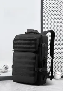 Detail of black tactical backpack featuring MOLLE webbing system and durable nylon fabric