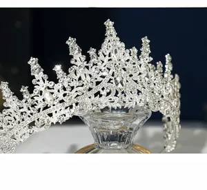 Macro detail of silver bridal crown with intricate rhinestones and teardrop crystals