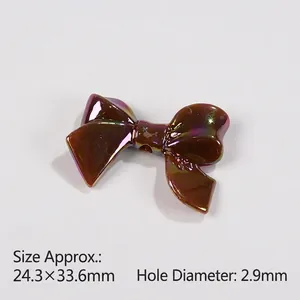 Detail of metallic AB color bow bead for DIY jewelry with size 24.3x33.6mm and 2.9mm hole
