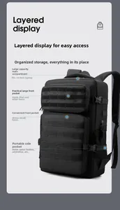 Layered view of black tactical backpack showing 14-inch laptop compartment and MOLLE system