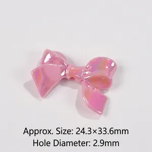 Detail view of pink bow resin bead with aurora finish and 2.9mm hole for DIY crafts