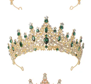 Detail view of gold crown featuring emerald green rhinestones and intricate metalwork