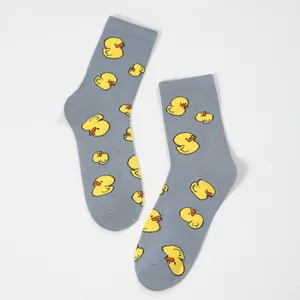 Mid-calf crew socks in heather gray with cute all-over yellow cartoon duck pattern