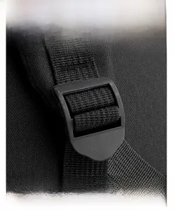 Detail of adjustable shoulder strap with durable plastic buckle on black travel backpack