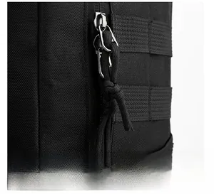 Detail of durable dual metal zippers with paracord pulls on a black travel backpack