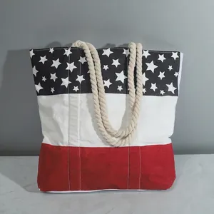 Canvas tote bag featuring American flag stars and stripes design with cotton rope handles