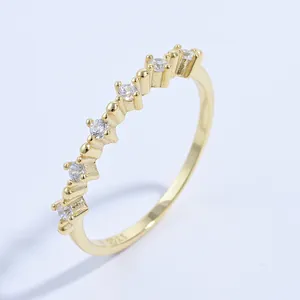 Macro shot of S925 hallmark on minimalist 18K gold plated silver ring with zircons