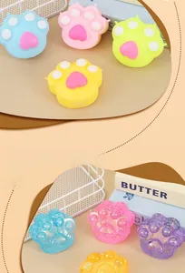 Close-up of cat paw squishy toys in solid and glitter translucent maltose textures