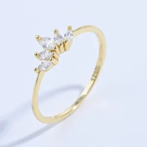 Close-up of S925 silver hallmark on 18K gold ring with marquise-cut zircons