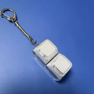 Mechanical keyboard fidget toy keychain with dual translucent keycaps and glowing feature