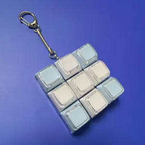 3x3 mechanical keyboard fidget toy keychain with light blue and white keycaps