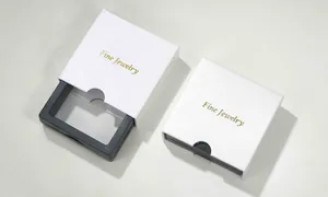 Luxury white paper drawer jewelry box with gold embossed Fine Jewelry logo and black lining