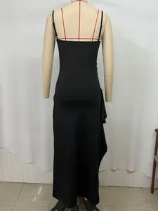Detail of a black bodycon maxi dress back view with thin straps on a mannequin